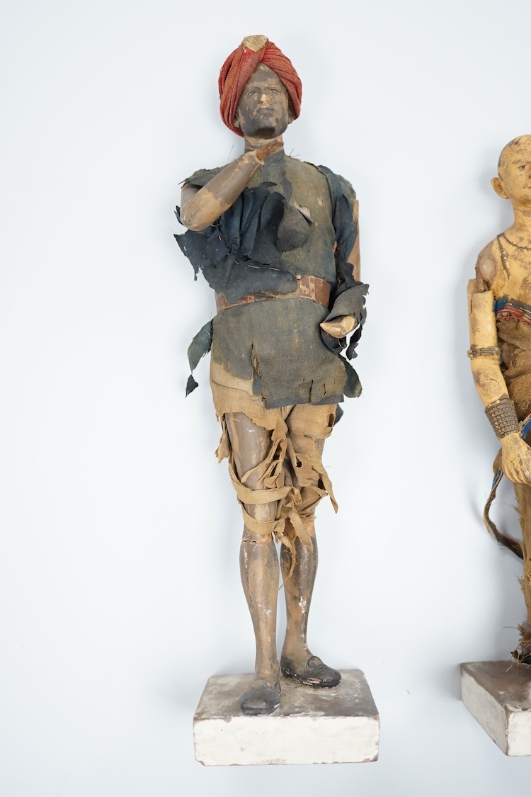 Two Indian clay figures, 26cm high
